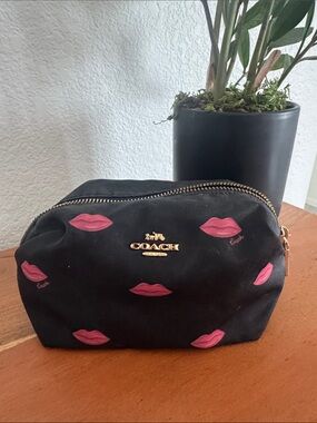 COACH Black Cosmetic Pouch with Pink Lip Print